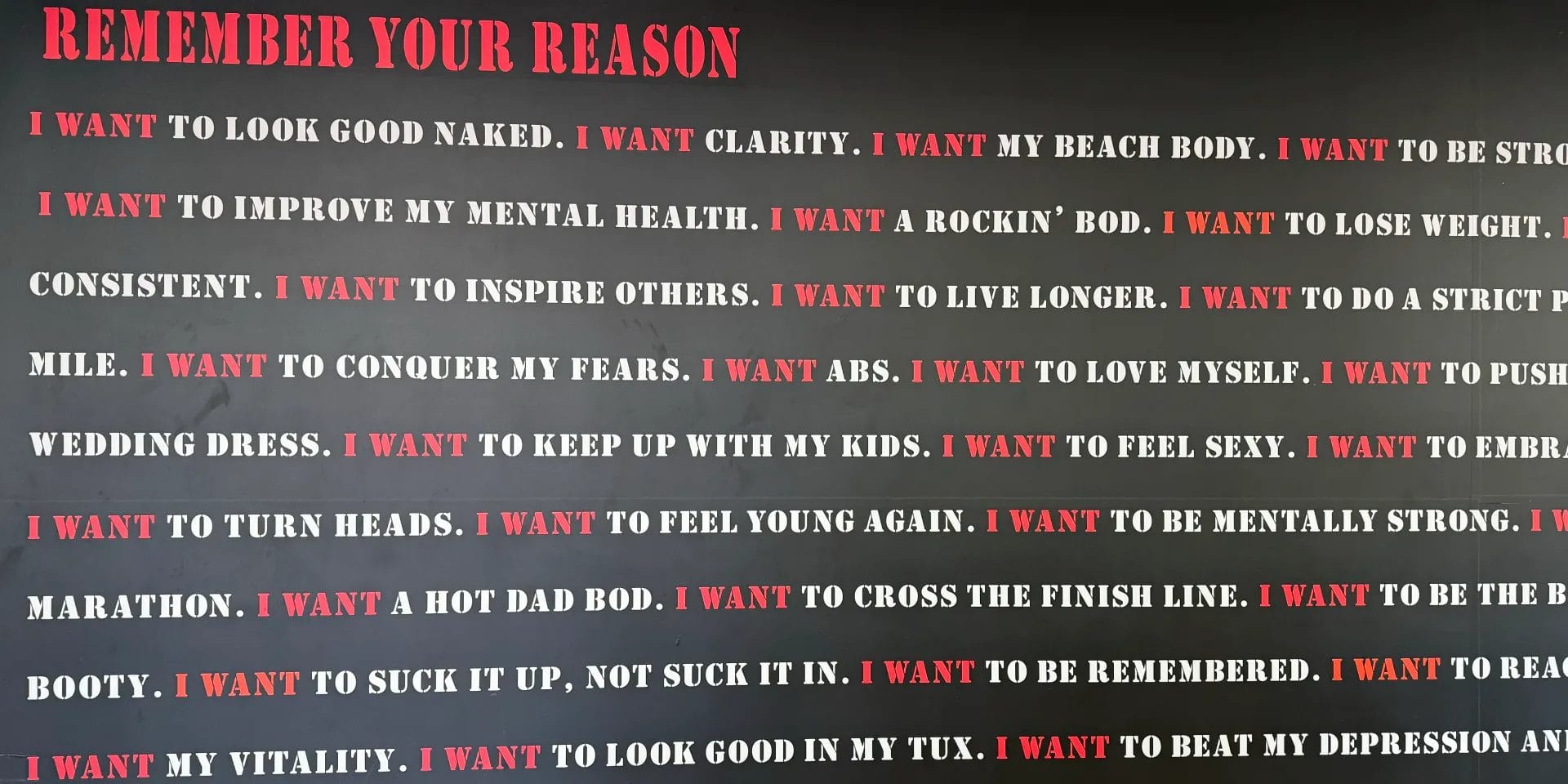 Text on the gym wall